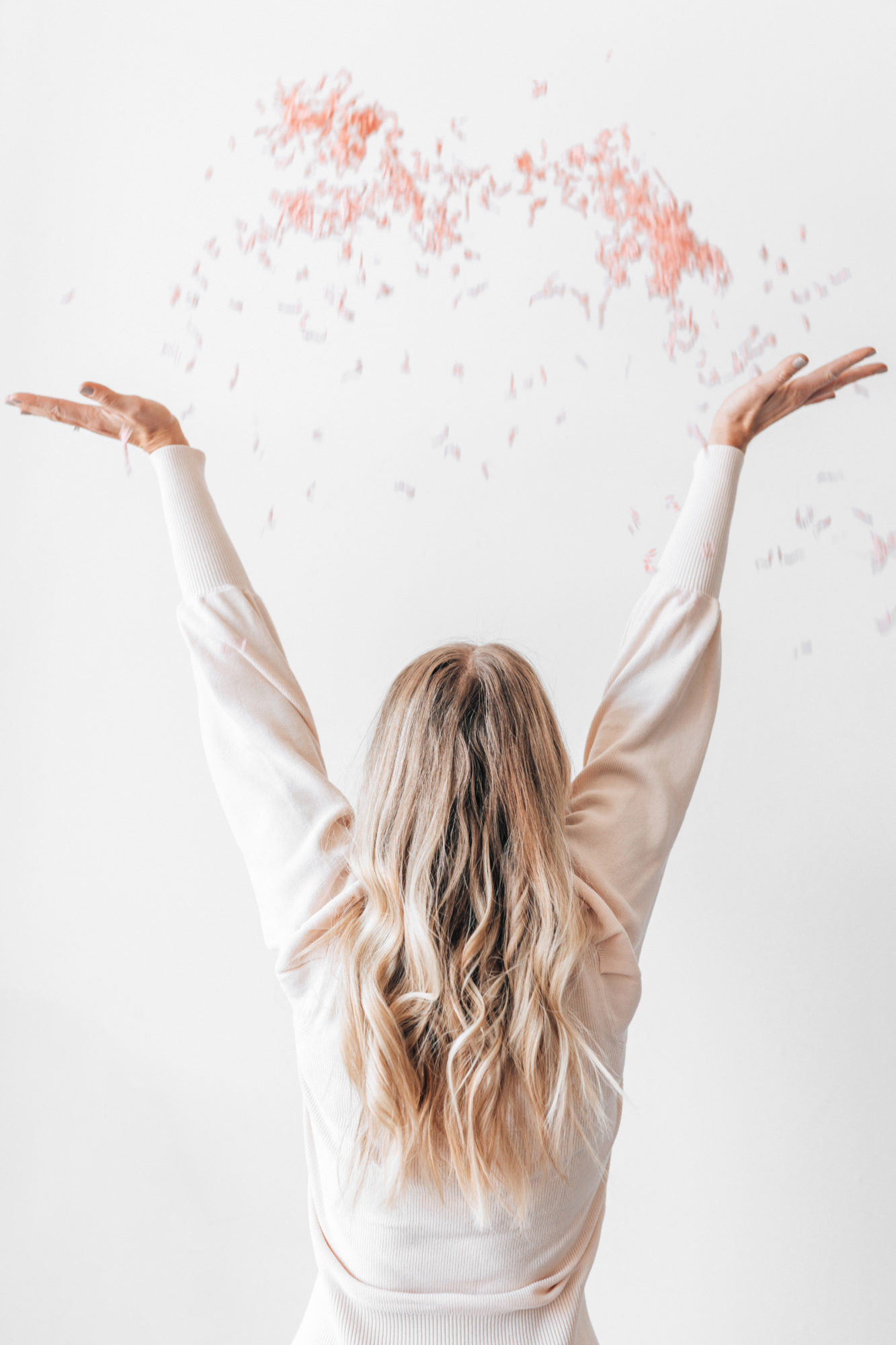 Woman throwing confetti